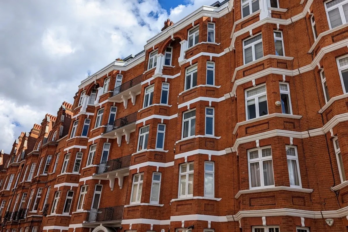 a red-brick London mansion block of flats near Barnet, London